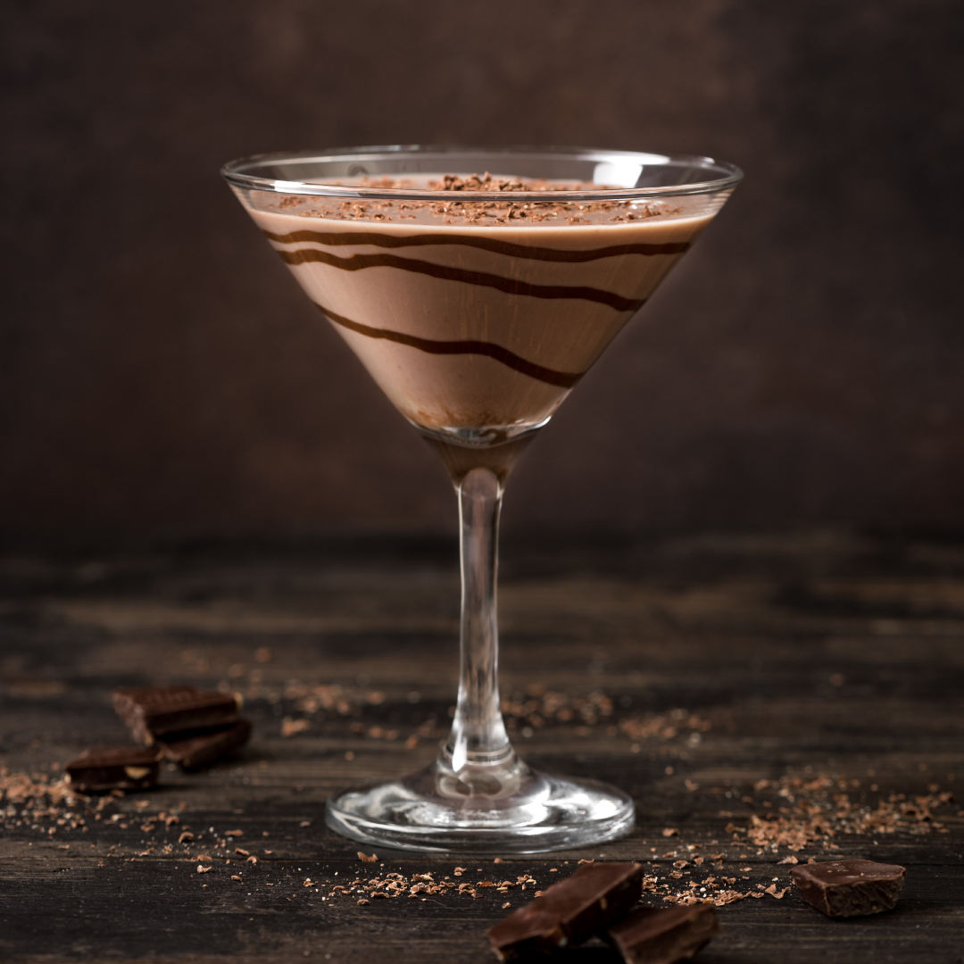 chocolate cocktail in a martini glass with chocolate drizzle